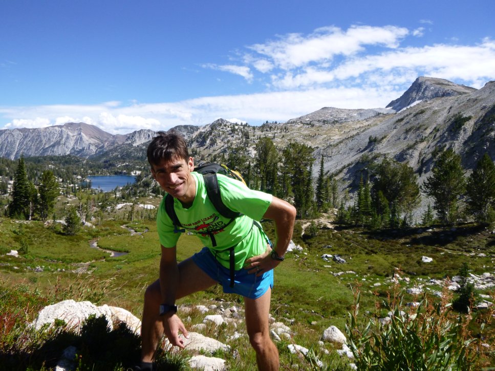 Torrey Lindbo standing outdoors with mountains and lake in background